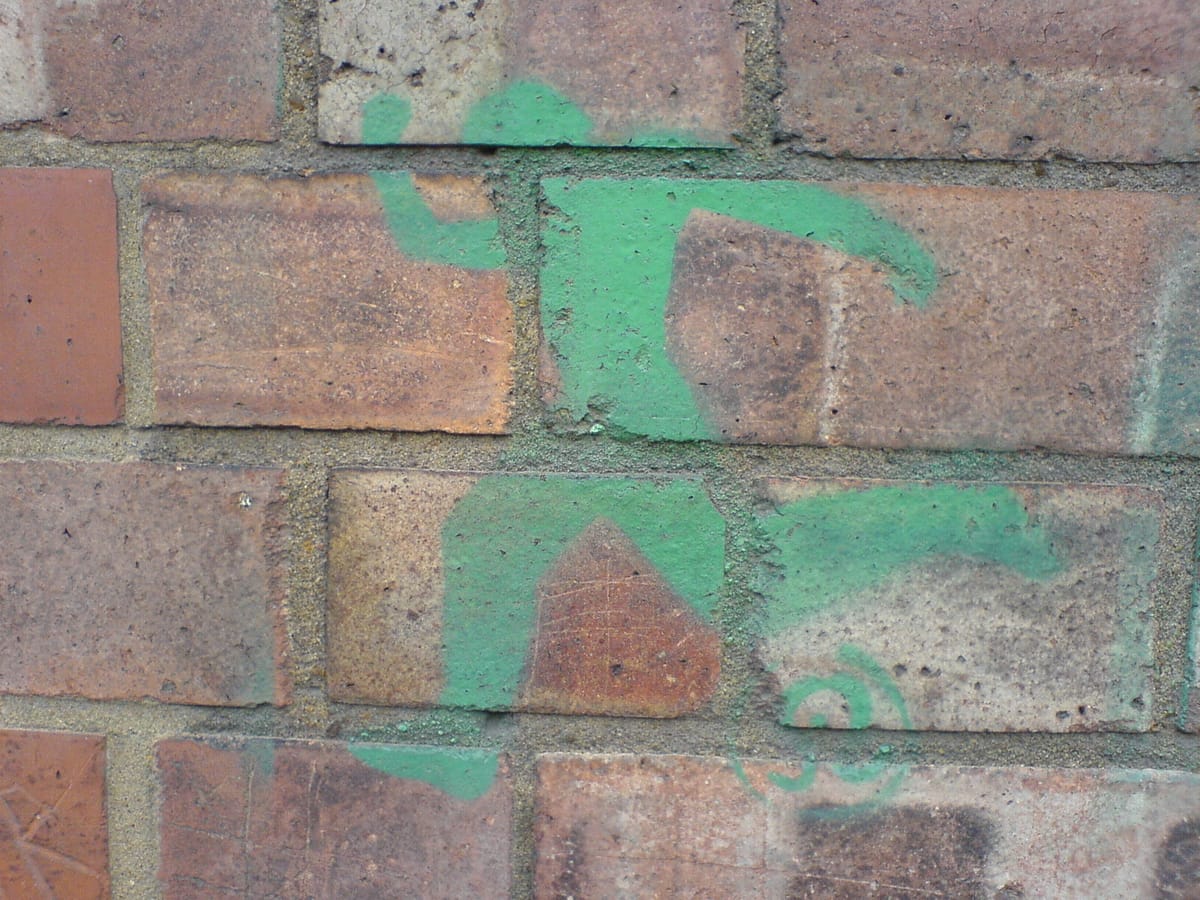 Image of runner sprayed on a wall