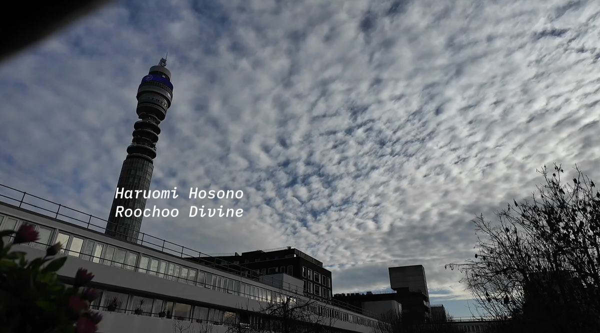 Clouds and the BT Tower, the words Harumi Hosono, Roochoo Divine superimposed