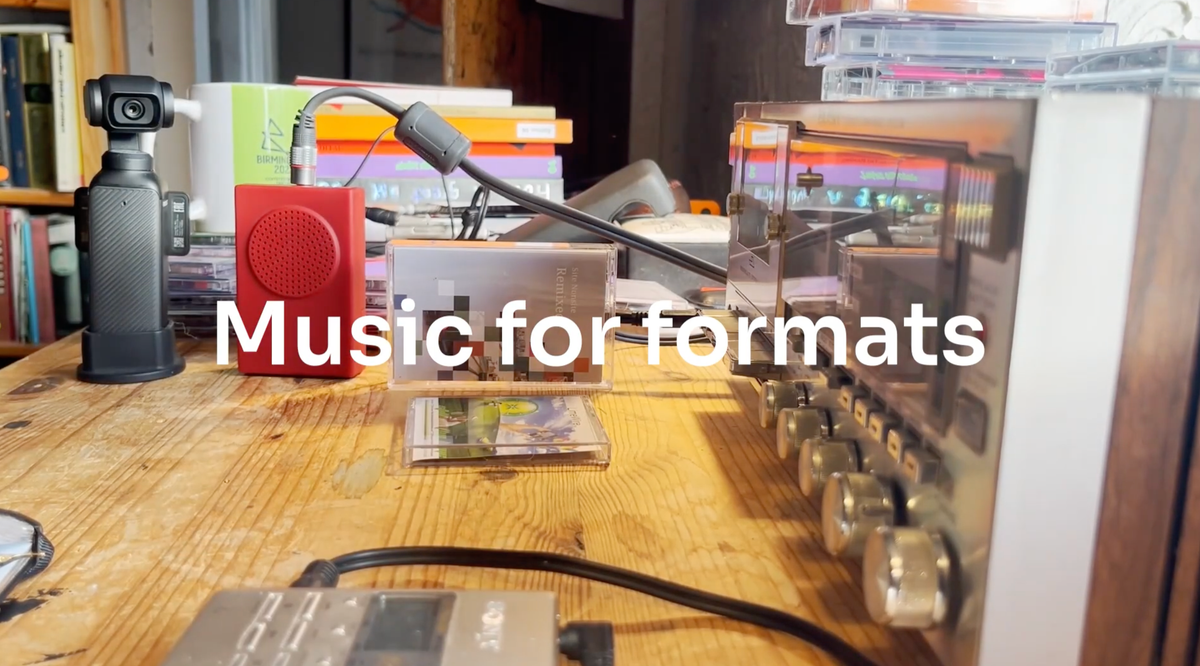 A desktop recording environment with mindisc and cassette player with the words Music for Formats over the top