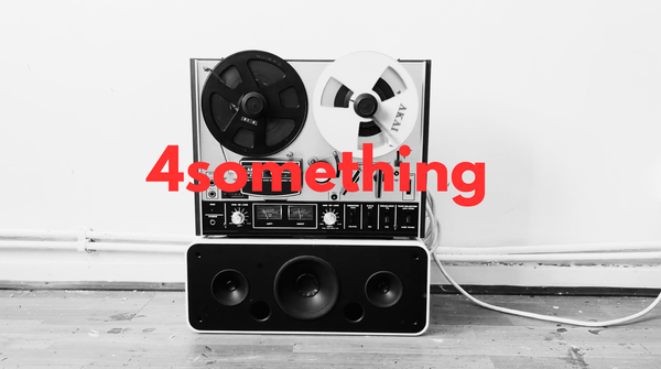 a black and white photo of a reel to reel tape recorder with the words 4something superimposed